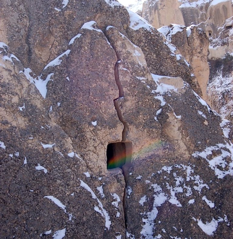 Magical Discovery: A Rock Face with a Misty Hole Creating Tiny Rainbows – Like Stepping Into a Fairy Tale World!